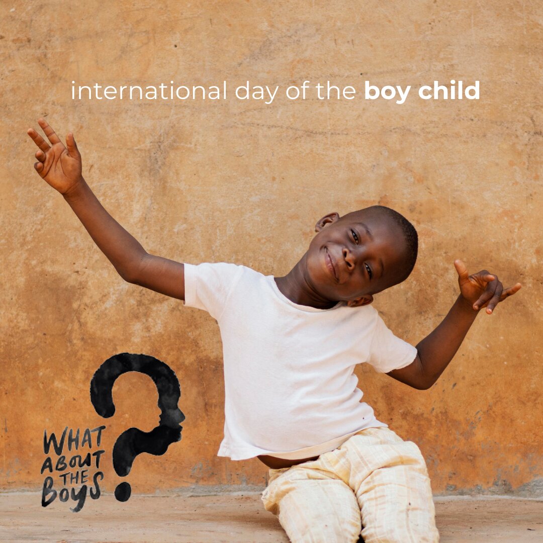 a boy sitting on the ground with his arms up | Primestars | What About the boys | International day of the boy child